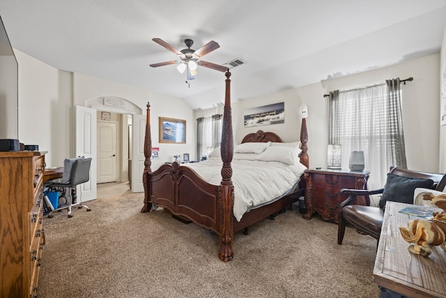 carpeted bedroom featuring ceiling fan and vaulted ceiling