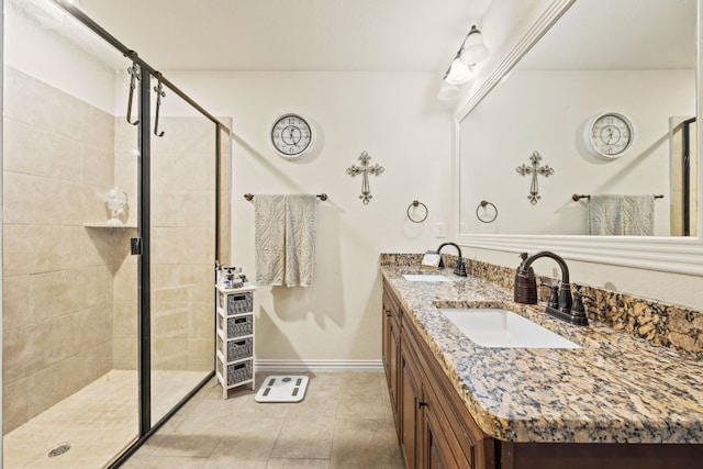 bathroom with tile flooring, double sink, an enclosed shower, and vanity with extensive cabinet space