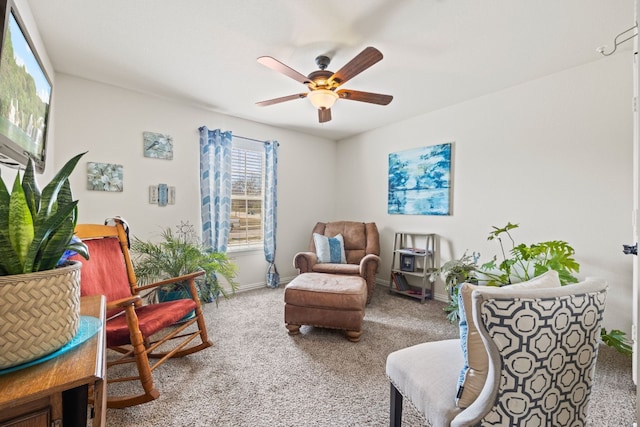 living area with ceiling fan and light carpet