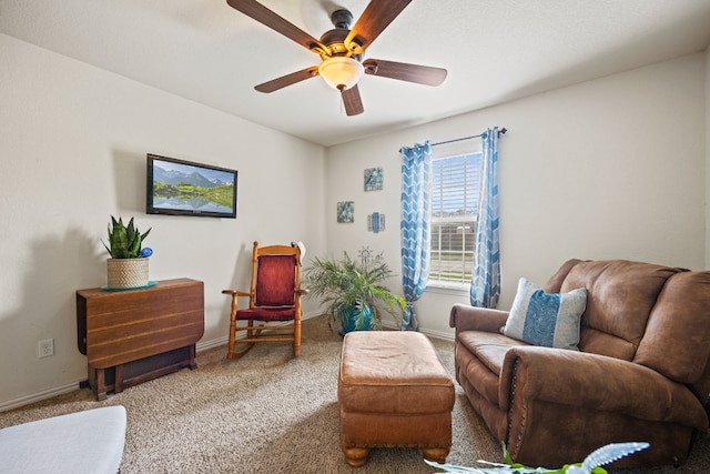 carpeted living room with ceiling fan