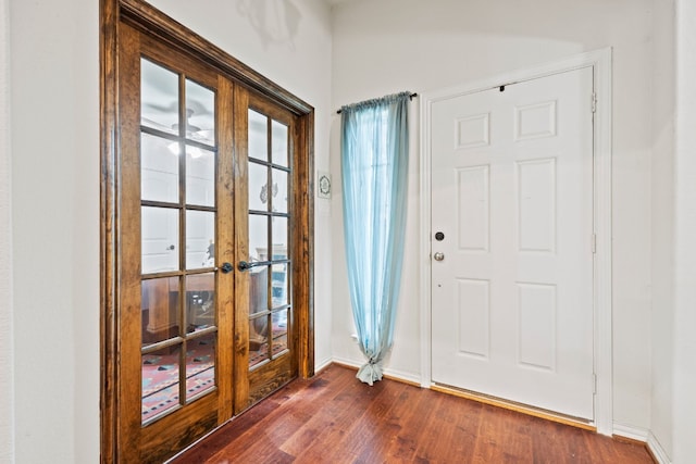 entrance foyer featuring dark hardwood / wood-style floors and french doors