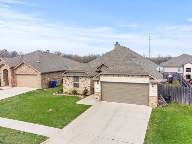 view of front of property with a front lawn and a garage