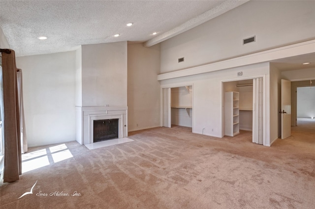 unfurnished living room featuring light carpet, high vaulted ceiling, a textured ceiling, and beamed ceiling