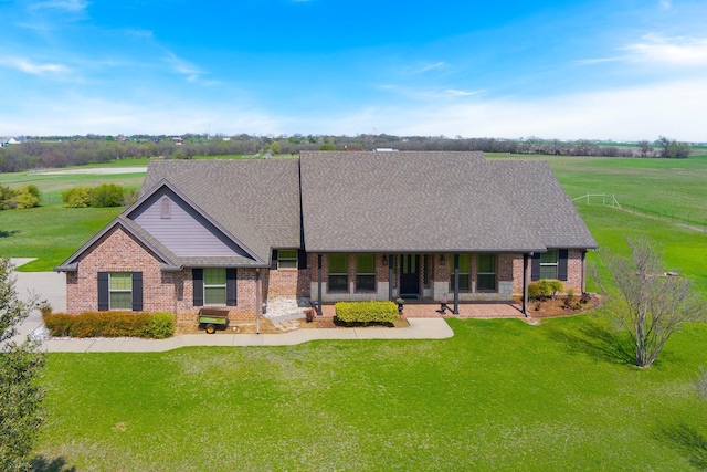 ranch-style house featuring a patio and a front lawn