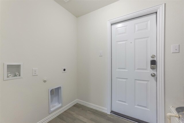 laundry area with gas dryer hookup, hookup for a washing machine, electric dryer hookup, and dark wood-type flooring