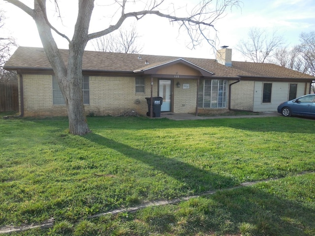 ranch-style house with a front yard