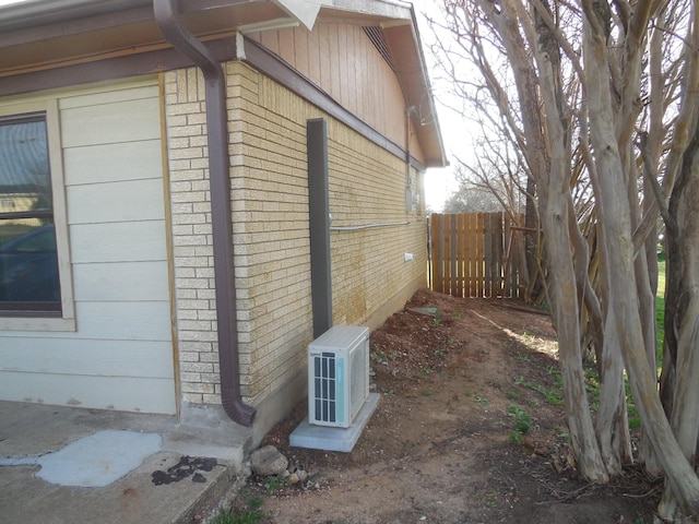 view of side of property featuring ac unit