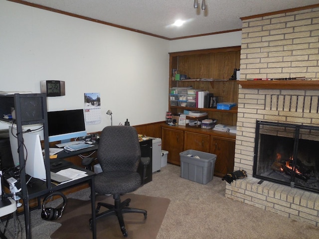 home office with crown molding, a textured ceiling, wooden walls, light colored carpet, and a fireplace