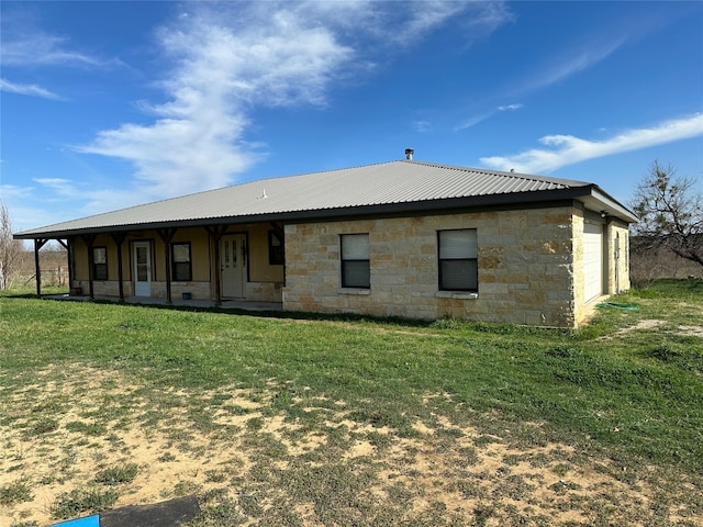 back of house with a yard and a porch