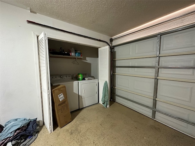 garage with washing machine and dryer