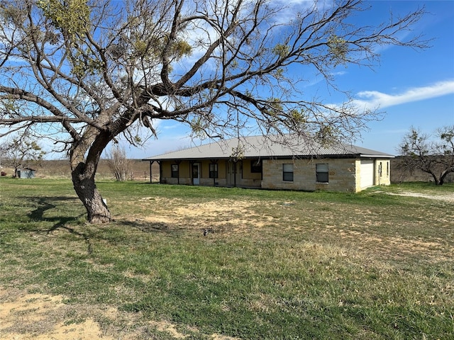 rear view of house with a yard