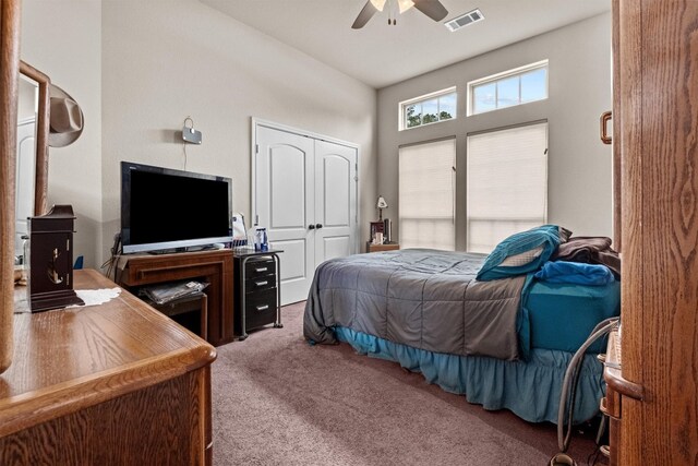 carpeted bedroom featuring ceiling fan