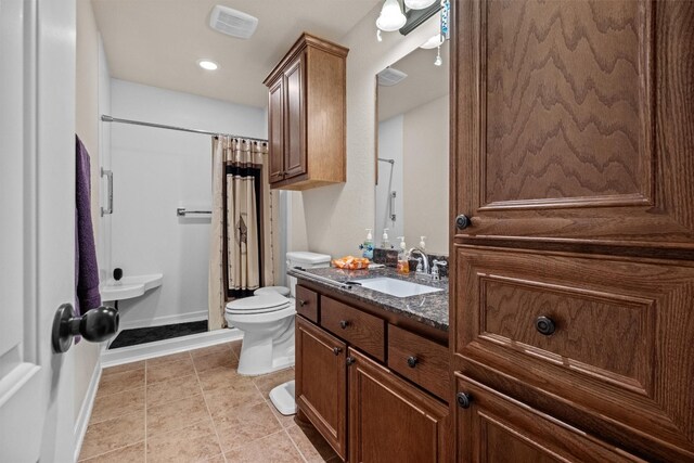 bathroom with toilet, a shower with shower curtain, tile flooring, and vanity