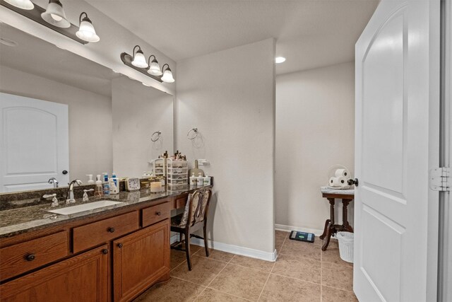 bathroom featuring tile floors and oversized vanity