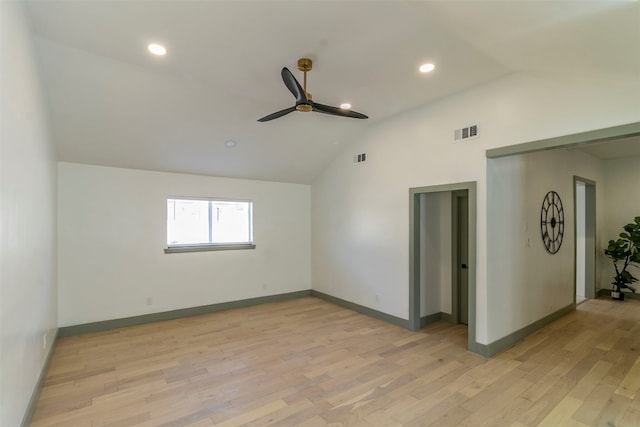 spare room with ceiling fan, high vaulted ceiling, and light hardwood / wood-style floors