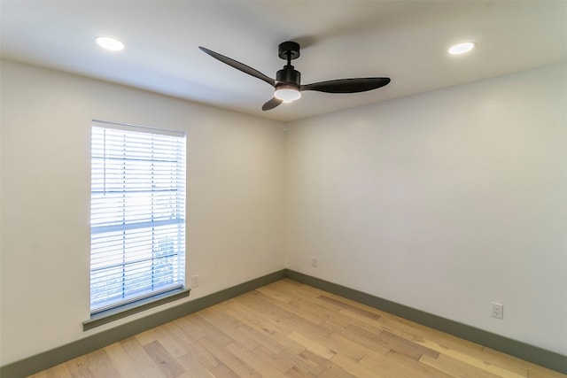 empty room featuring ceiling fan and light hardwood / wood-style flooring