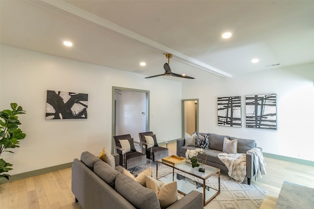 living room with light hardwood / wood-style floors, ceiling fan, and beam ceiling