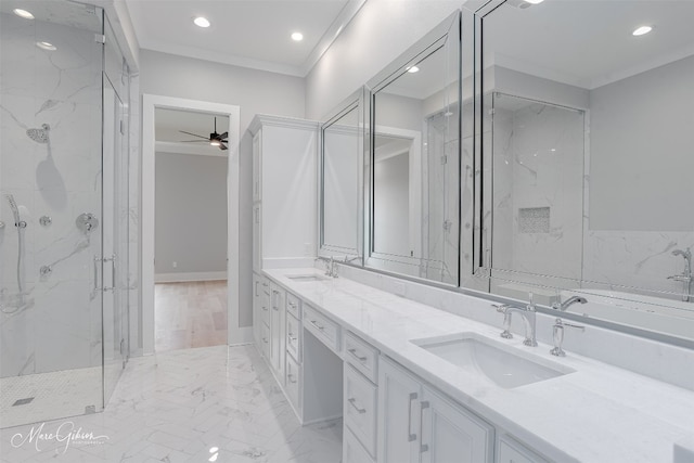 bathroom featuring ceiling fan, large vanity, dual sinks, crown molding, and plus walk in shower