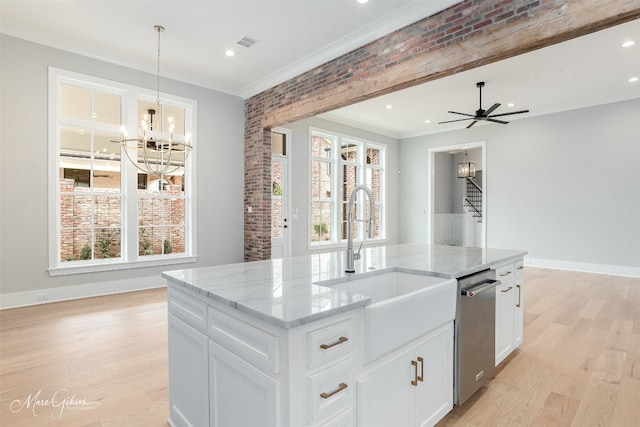 kitchen featuring light hardwood / wood-style floors, a center island with sink, stainless steel dishwasher, white cabinetry, and hanging light fixtures