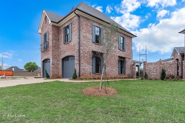 view of front of property with a front yard and a garage