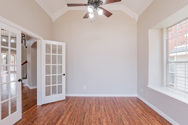 unfurnished room featuring vaulted ceiling, ornamental molding, ceiling fan, and dark hardwood / wood-style flooring