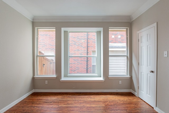 unfurnished room with crown molding and dark hardwood / wood-style flooring