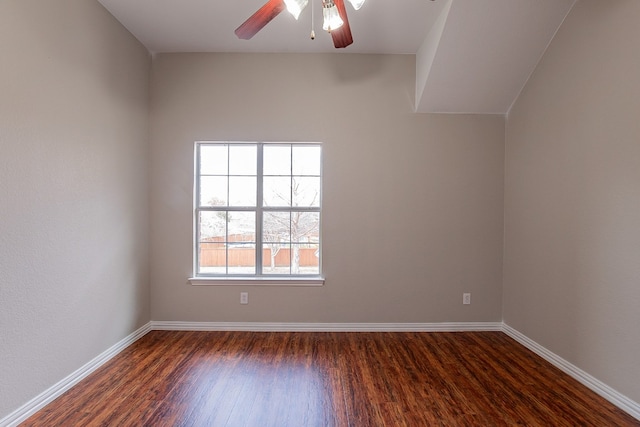 spare room with ceiling fan and dark wood-type flooring