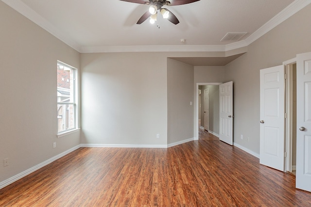 spare room featuring crown molding, dark hardwood / wood-style floors, and ceiling fan