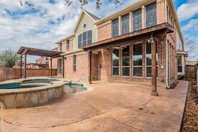 rear view of property featuring a pool with hot tub, a pergola, a patio area, and ceiling fan