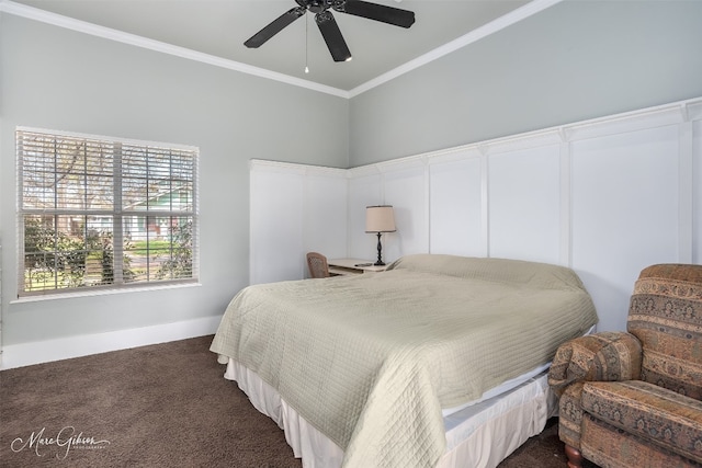 bedroom featuring ceiling fan, dark colored carpet, and crown molding