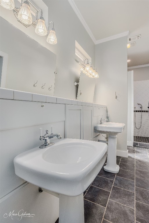 bathroom featuring tile flooring, sink, and ornamental molding