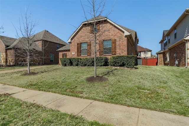 front facade featuring a front lawn