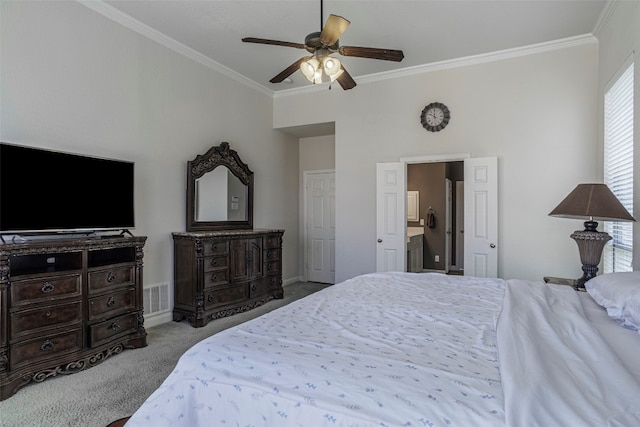 carpeted bedroom with ceiling fan and crown molding