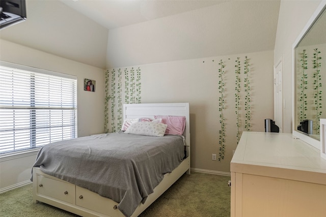 carpeted bedroom with vaulted ceiling