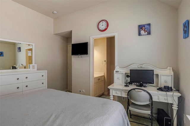 carpeted bedroom with connected bathroom