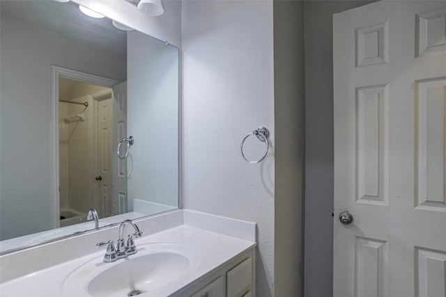 bathroom with shower / bathtub combination and vanity