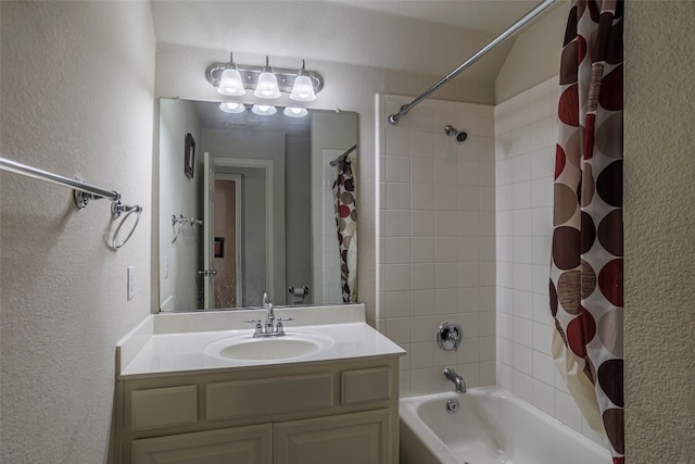 bathroom with shower / bathtub combination with curtain and vanity