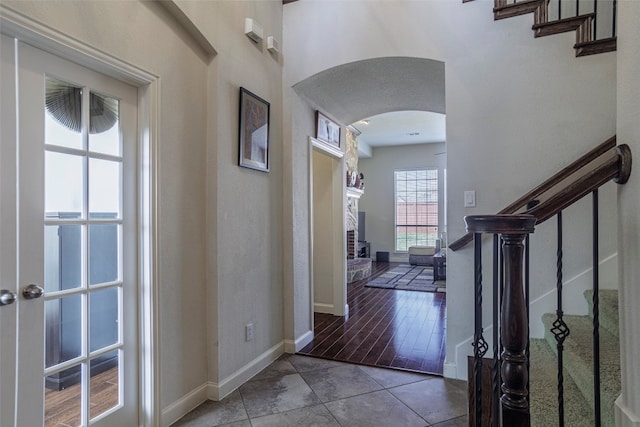 foyer with hardwood / wood-style flooring and a fireplace