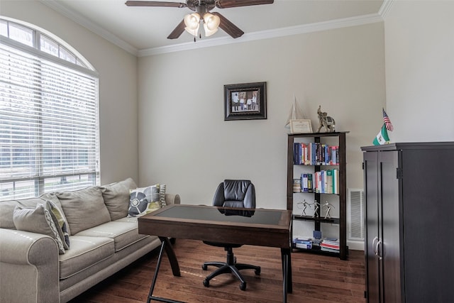 office space featuring dark hardwood / wood-style flooring, ceiling fan, crown molding, and plenty of natural light