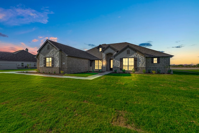 french provincial home with a yard