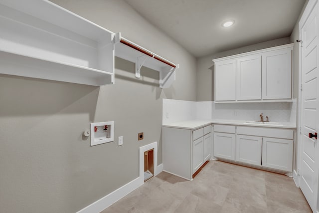 laundry area featuring hookup for a washing machine, cabinets, sink, and hookup for an electric dryer