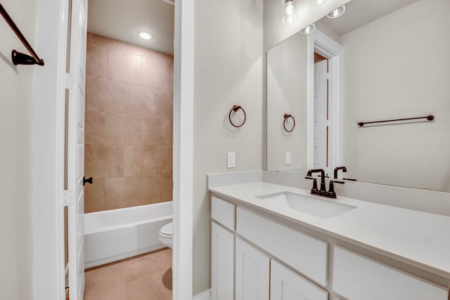 full bathroom featuring vanity, toilet, and tiled shower / bath