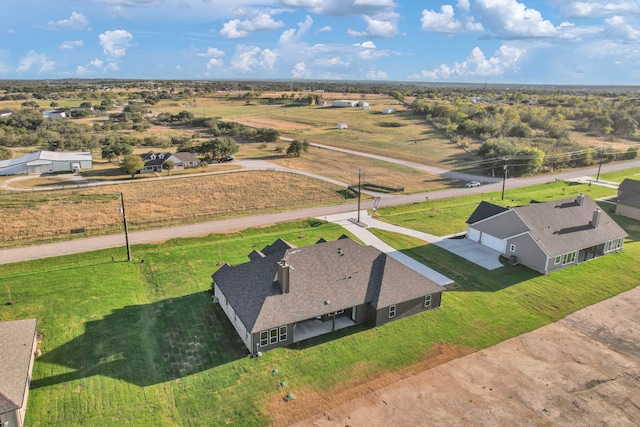 birds eye view of property featuring a rural view