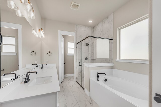 bathroom with vanity, independent shower and bath, and a healthy amount of sunlight