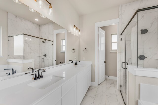 bathroom with vanity, plenty of natural light, and an enclosed shower