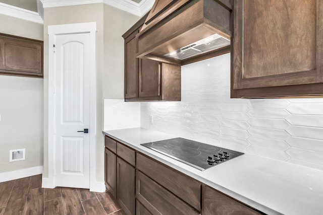 kitchen with stainless steel dishwasher, crown molding, and sink