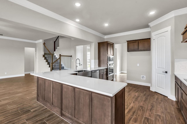 kitchen featuring ceiling fan, sink, dark wood-type flooring, hanging light fixtures, and black electric stovetop