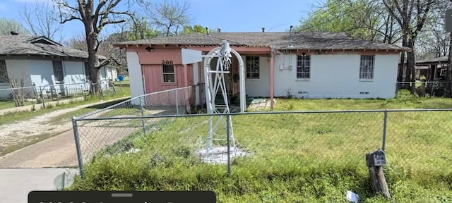 rear view of property with a lawn