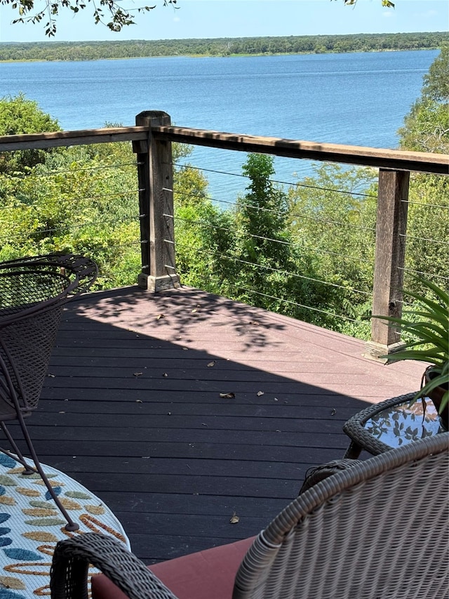 wooden deck featuring a water view