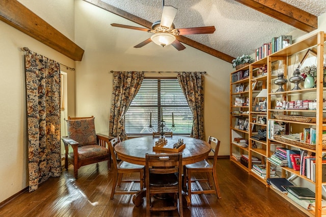 dining space with a textured ceiling, hardwood / wood-style floors, a ceiling fan, and vaulted ceiling with beams